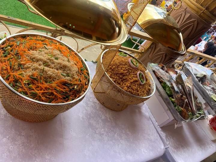 Festive Jollof & Fried Rice Buffet — chafing dishes at an event