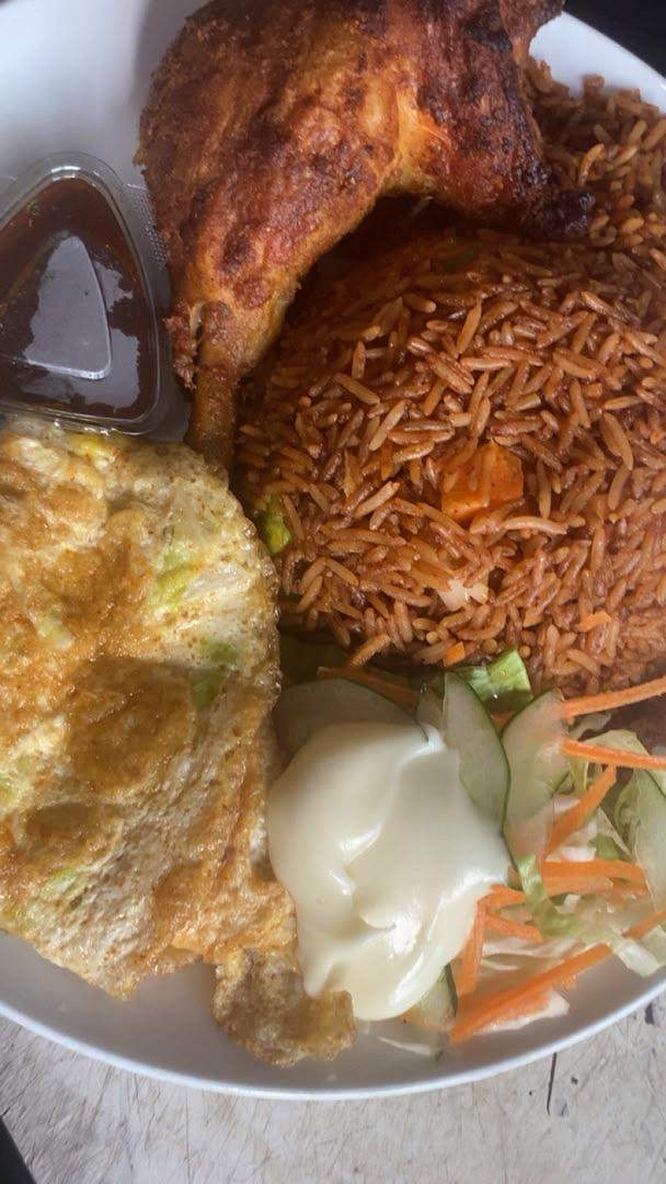 Classic Jollof Rice — with golden fried chicken and coleslaw